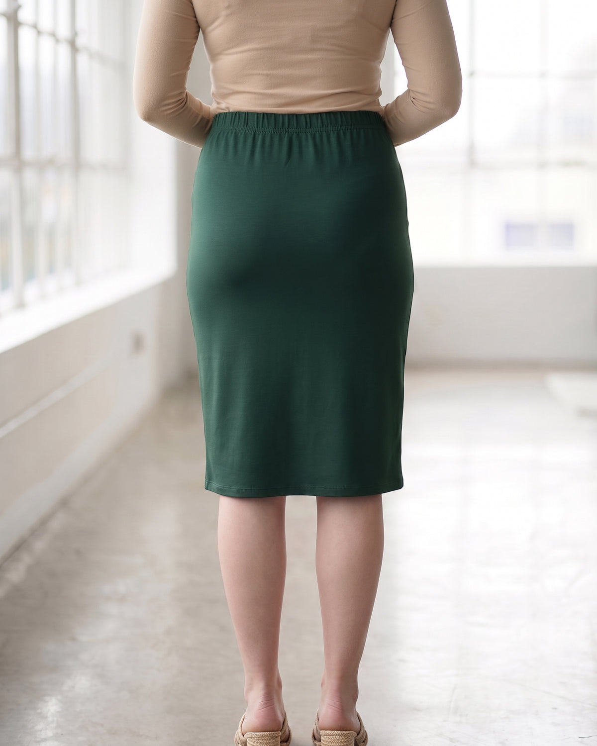Model wearing Nuggles® 27" Classic Skirt in Hunter Green