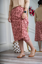 Woman wearing 27-inch tropical flower modest sport skirt with built-in leggings—ideal for activewear, cycling, running, swimming, and workouts.