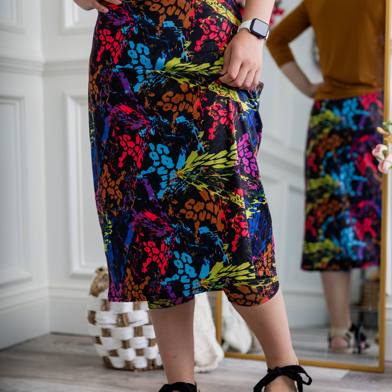 Woman wearing 27-inch tropical flower modest sport skirt with built-in leggings—ideal for activewear, cycling, running, swimming, and workouts.