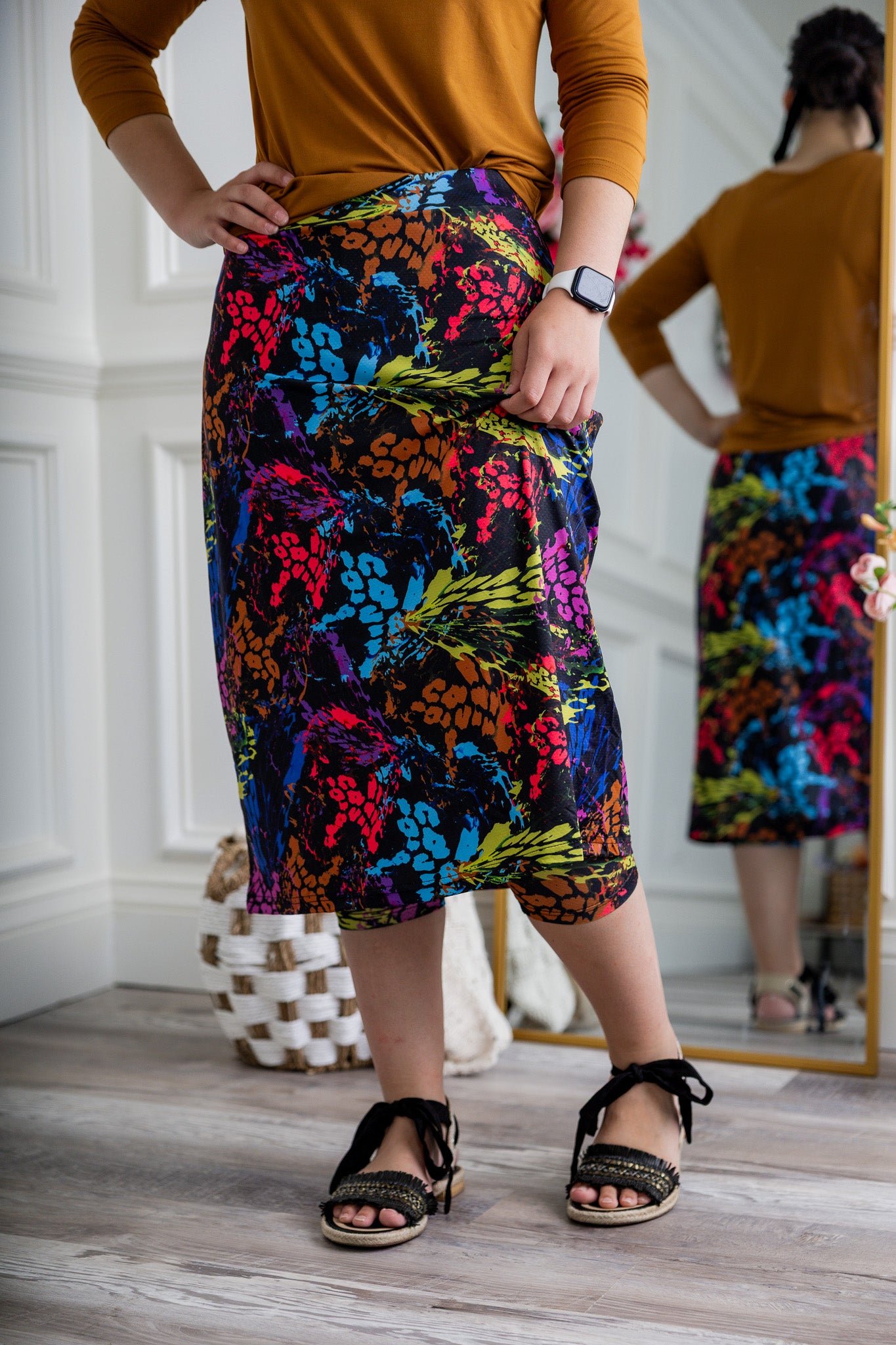 Woman wearing 27-inch tropical flower modest sport skirt with built-in leggings—ideal for activewear, cycling, running, swimming, and workouts.