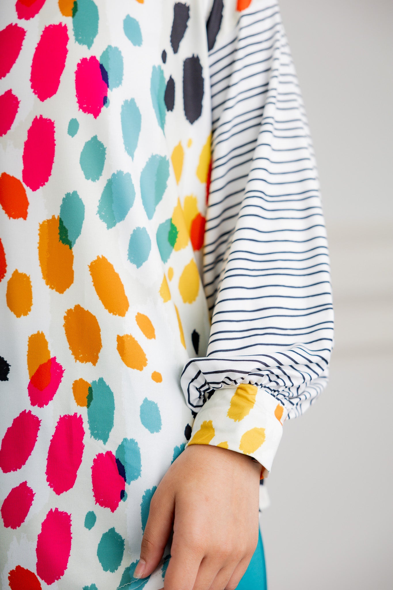 Modest women's long sleeve knit top with contrasting prints, sleeve cuffs, styled for casual or dressy wear by Nuggles®.