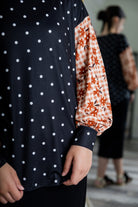 Modest women's long sleeve knit top with contrasting prints, sleeve cuffs, styled for casual or dressy wear by Nuggles®.
