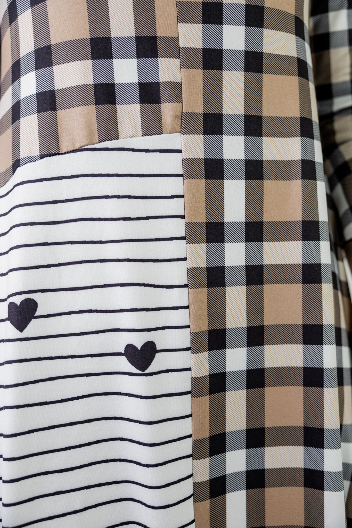 Modest high low knit dress with asymmetrical hem, ruffle sleeves, and mixed front prints – Kristine Dress by Nuggles®