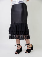 Model wearing 27" lace layering slip with tiered lace hem, designed for modest layering under skirts or dresses.