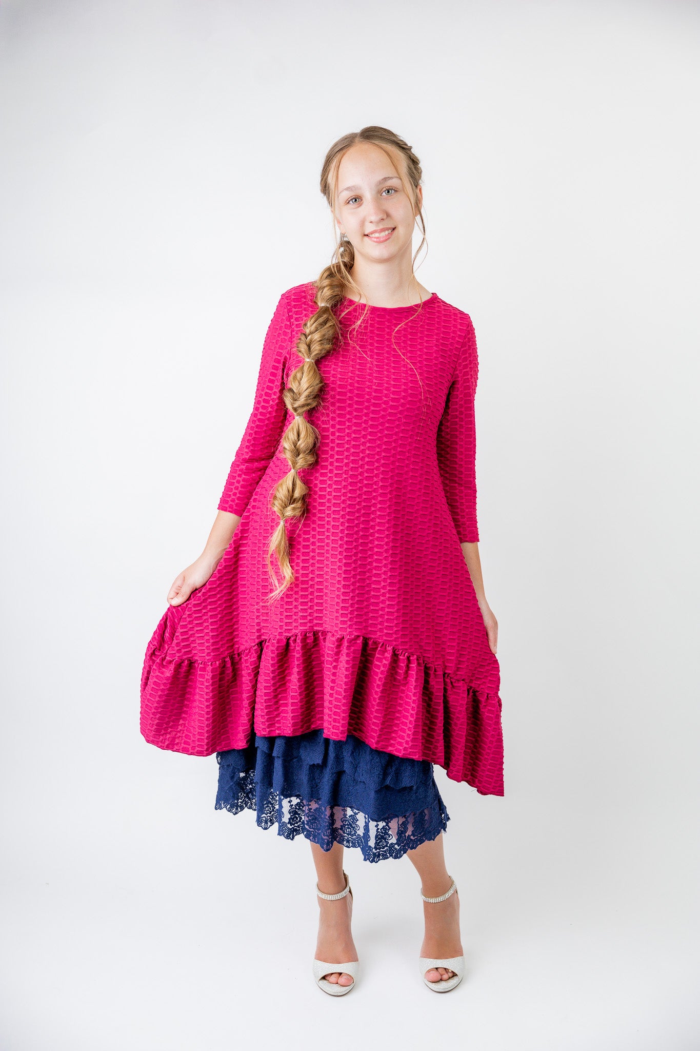 Model wearing 27" lace layering slip with tiered lace hem, designed for modest layering under skirts or dresses.