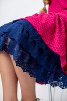 Model wearing 27" lace layering slip with tiered lace hem, designed for modest layering under skirts or dresses.