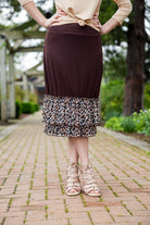 Chocolate brown 27" slip skirt with a layered leopard print ruffle hem, styled for a modest look.