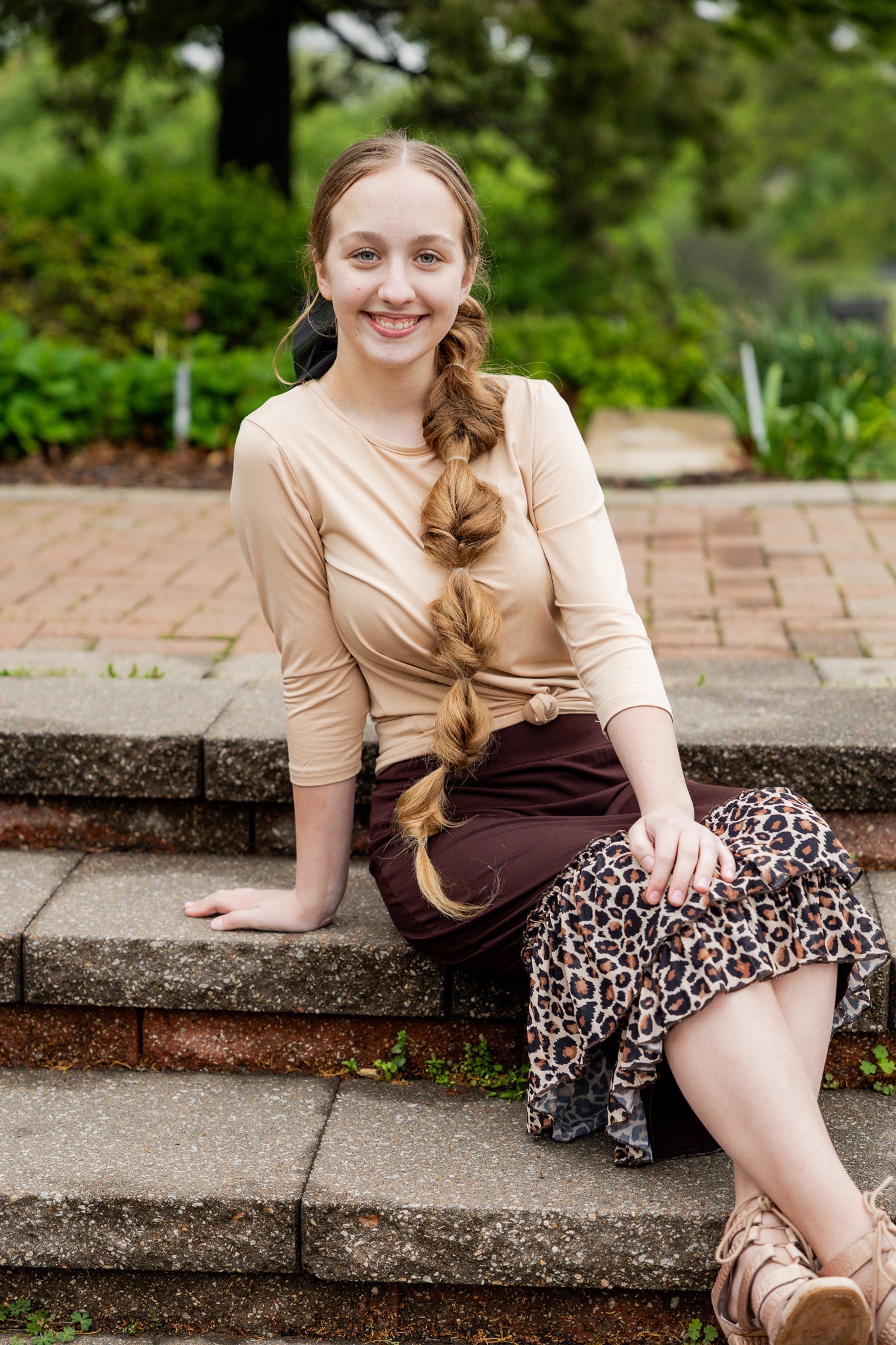 Chocolate brown 27" slip skirt with a layered leopard print ruffle hem, styled for a modest look.