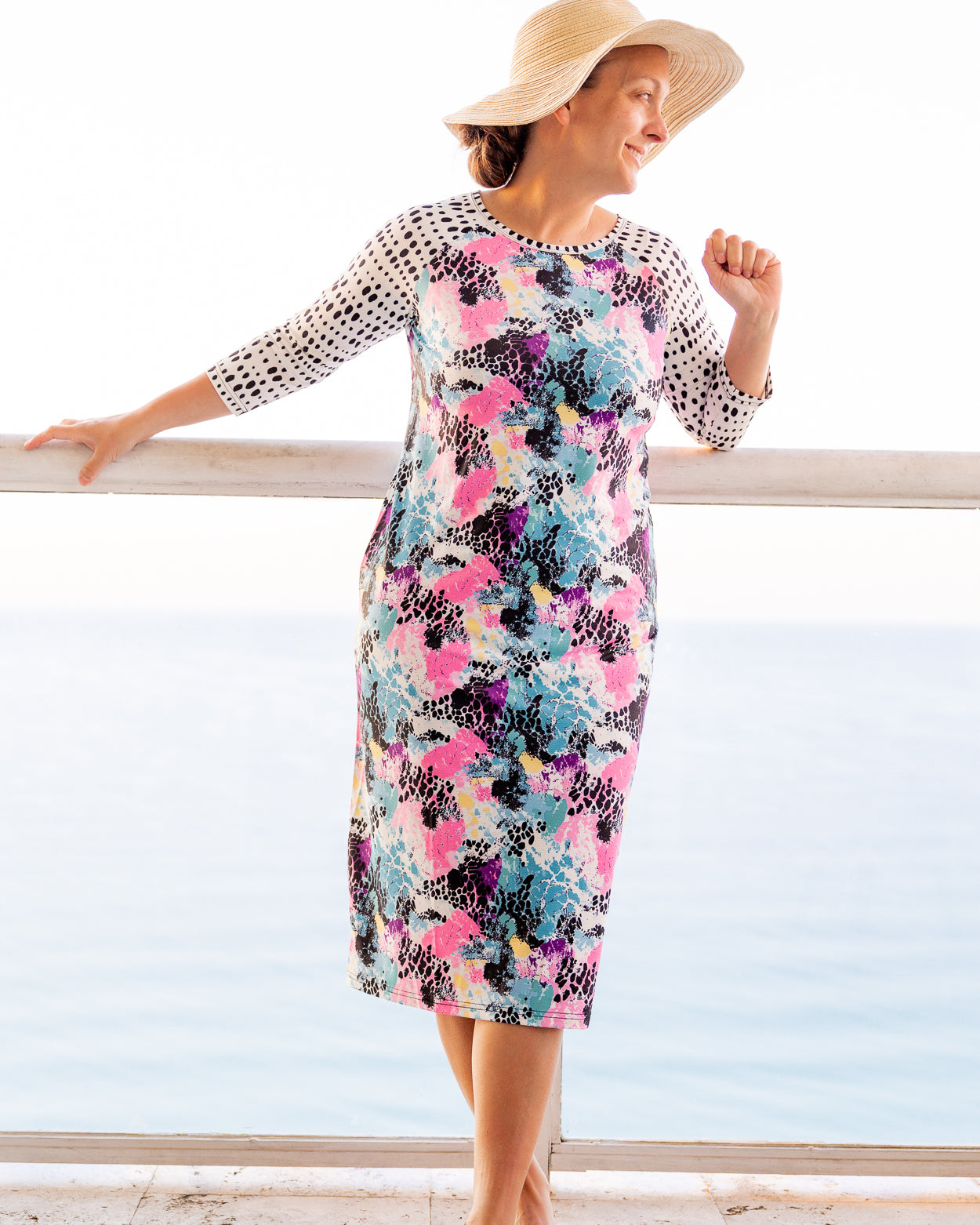 Model wearing Nuggles® Sport Swim Dress in Watercolor Blossom