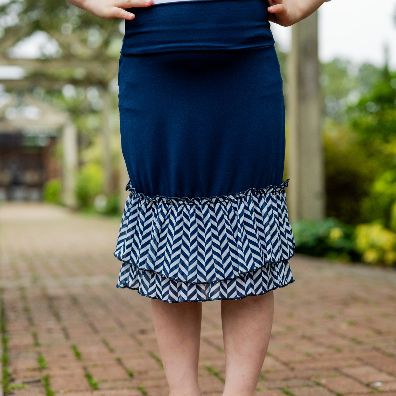 Modest girls’ ruffle slip with wide no-elastic waistband, perfect for layering under dresses and skirts.