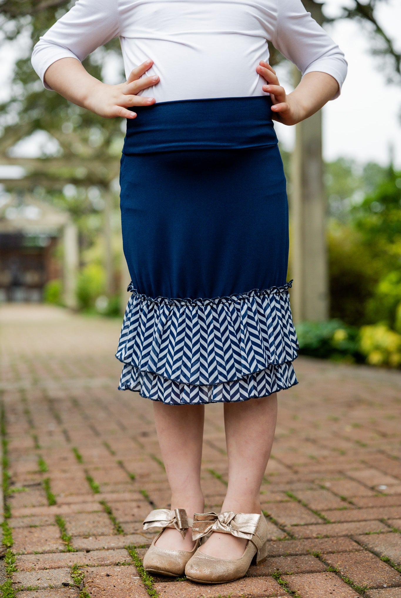 Modest girls’ ruffle slip with wide no-elastic waistband, perfect for layering under dresses and skirts.