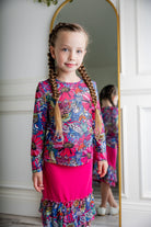 Girl wearing long sleeve mesh layering top by Nuggles® in breathable stretch fabric.