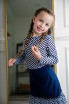 Girl wearing long sleeve mesh layering top by Nuggles® in breathable stretch fabric.