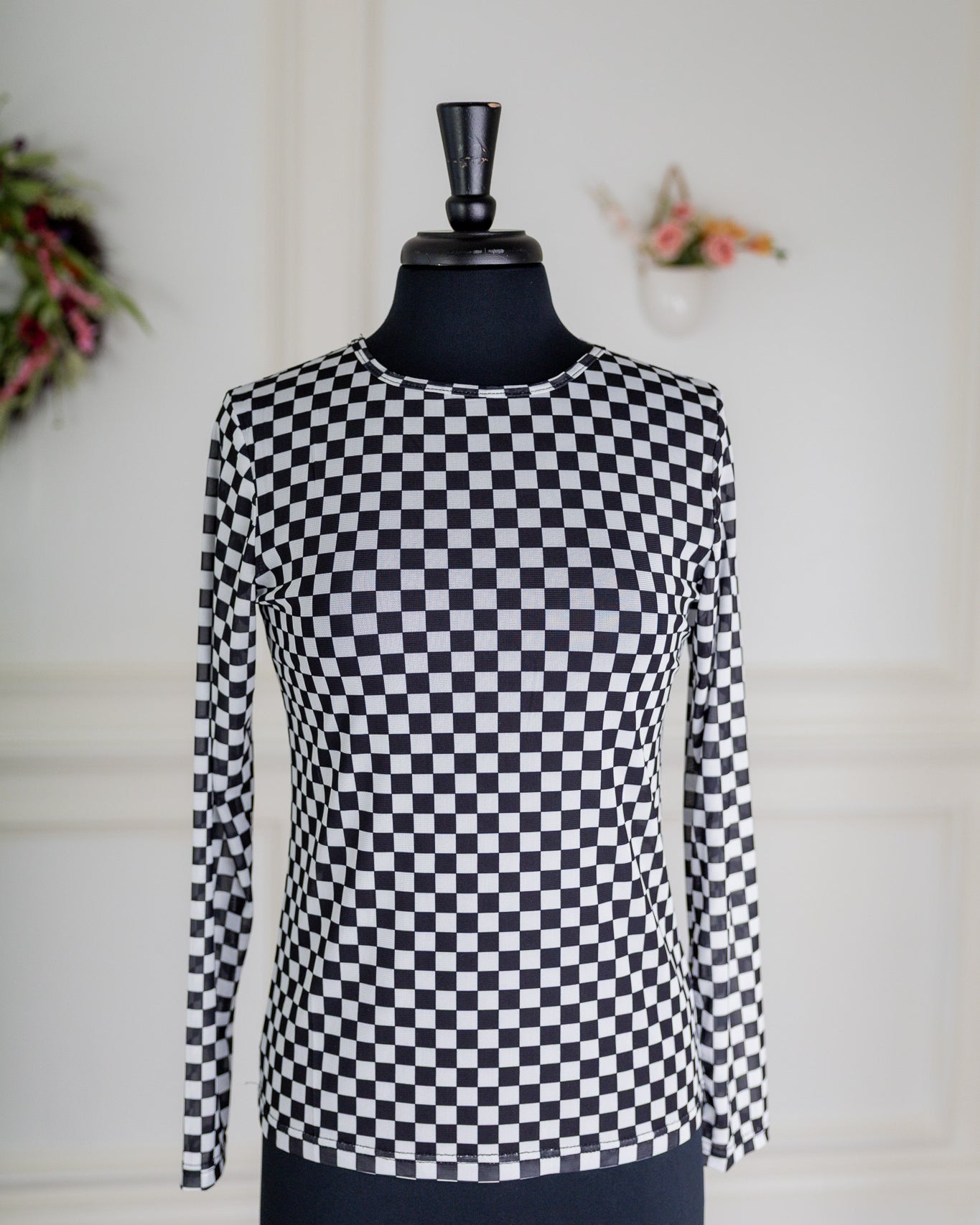 Girl wearing long sleeve mesh layering top by Nuggles® in breathable stretch fabric.