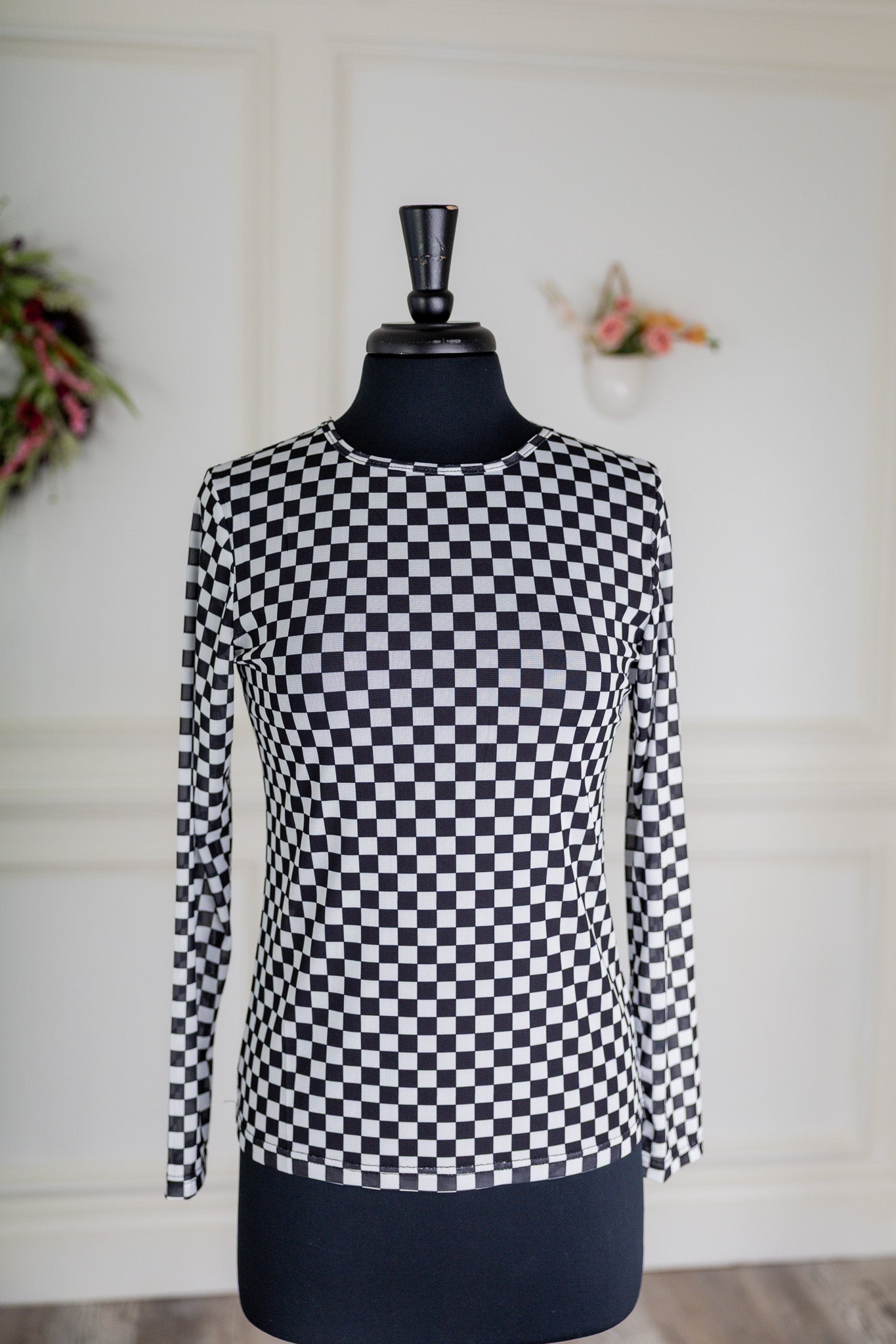 Girl wearing long sleeve mesh layering top by Nuggles® in breathable stretch fabric.