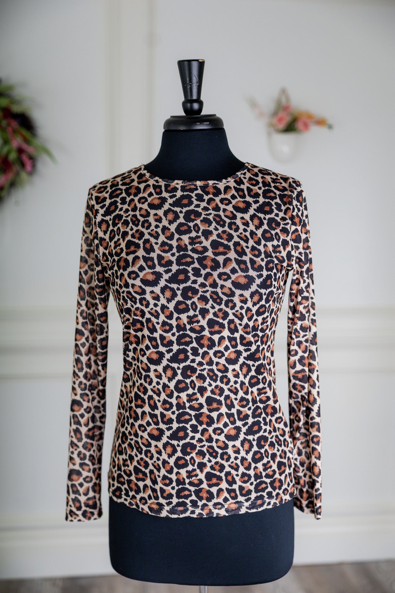 Girl wearing long sleeve mesh layering top by Nuggles® in breathable stretch fabric.