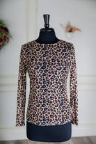 Girl wearing long sleeve mesh layering top by Nuggles® in breathable stretch fabric.