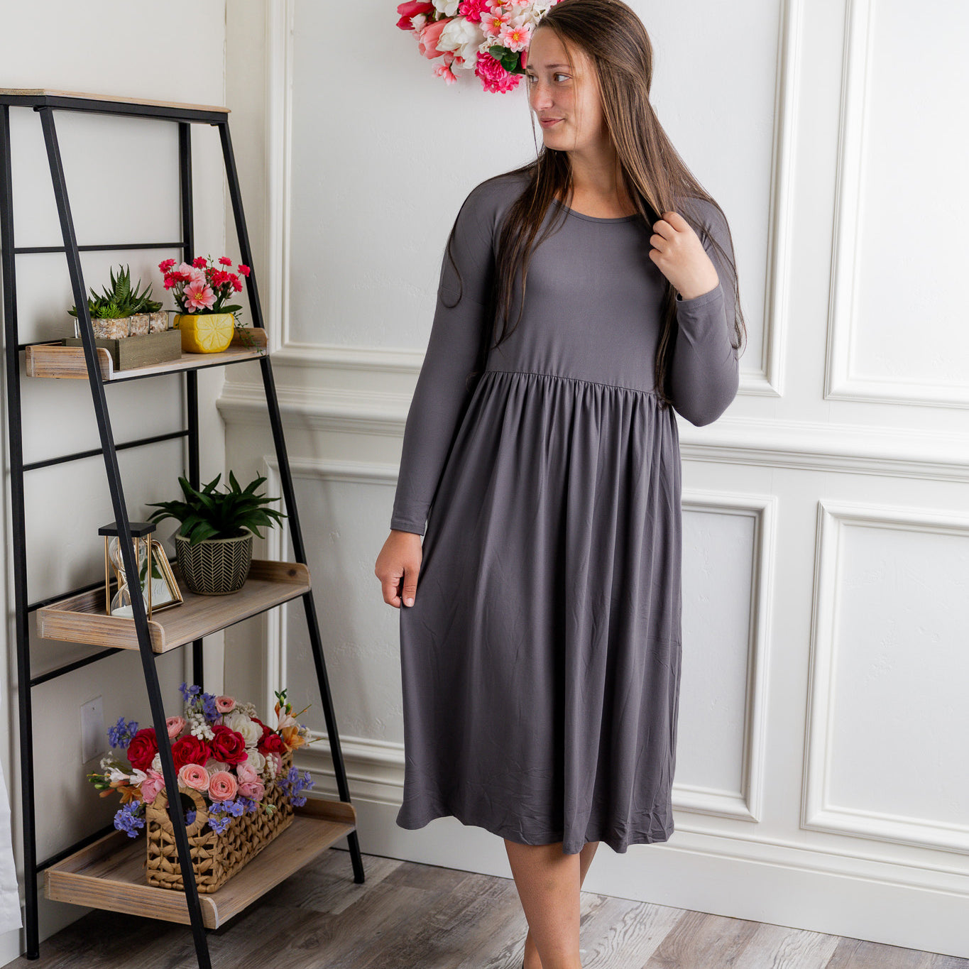 Nuggles® Farah Dress in solid color, modest long sleeve midi dress with empire waist, styled with flats for everyday wear.