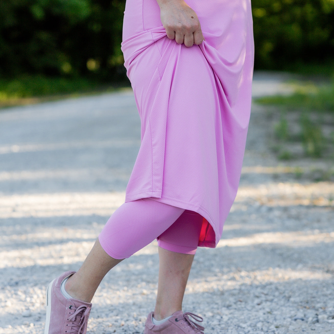 Modest activewear skirt with built-in leggings for women, breathable athletic fabric, paired with sneakers – perfect for workouts or casual wear.