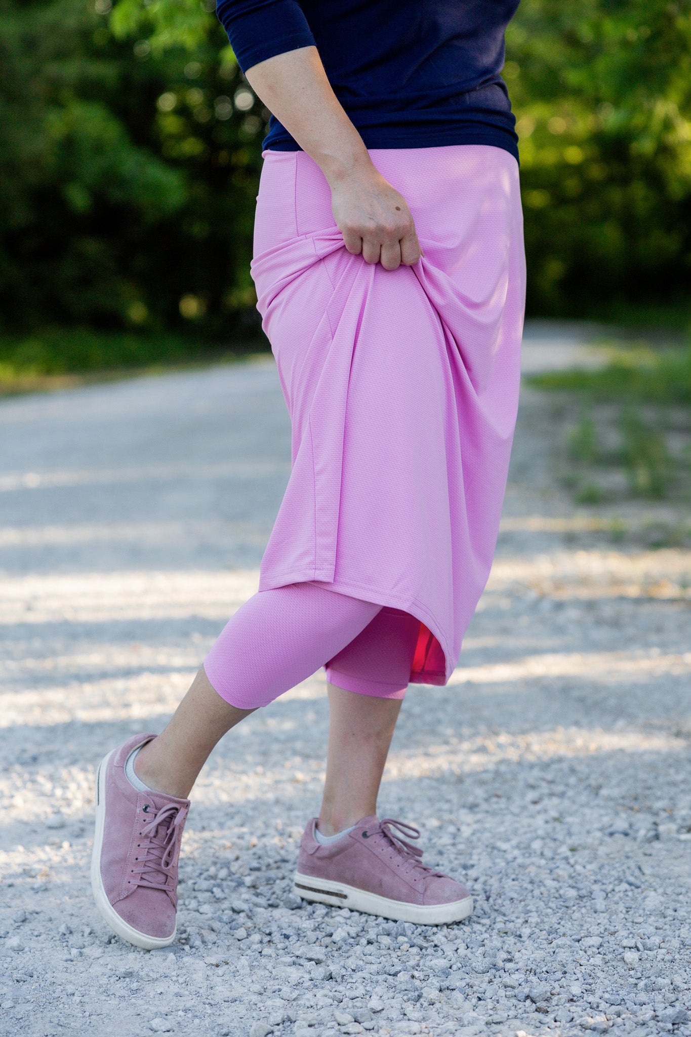 Modest activewear skirt with built-in leggings for women, breathable athletic fabric, paired with sneakers – perfect for workouts or casual wear.