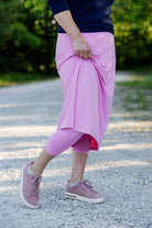 Modest activewear skirt with built-in leggings for women, breathable athletic fabric, paired with sneakers – perfect for workouts or casual wear.
