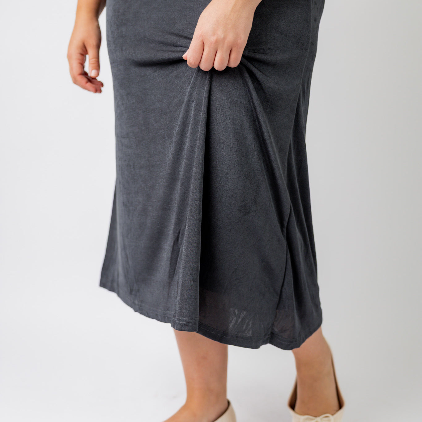 Nuggles® Renee Slinky Skirt – modest midi skirt in soft slinky stretch fabric, styled for everyday and dressy wear.