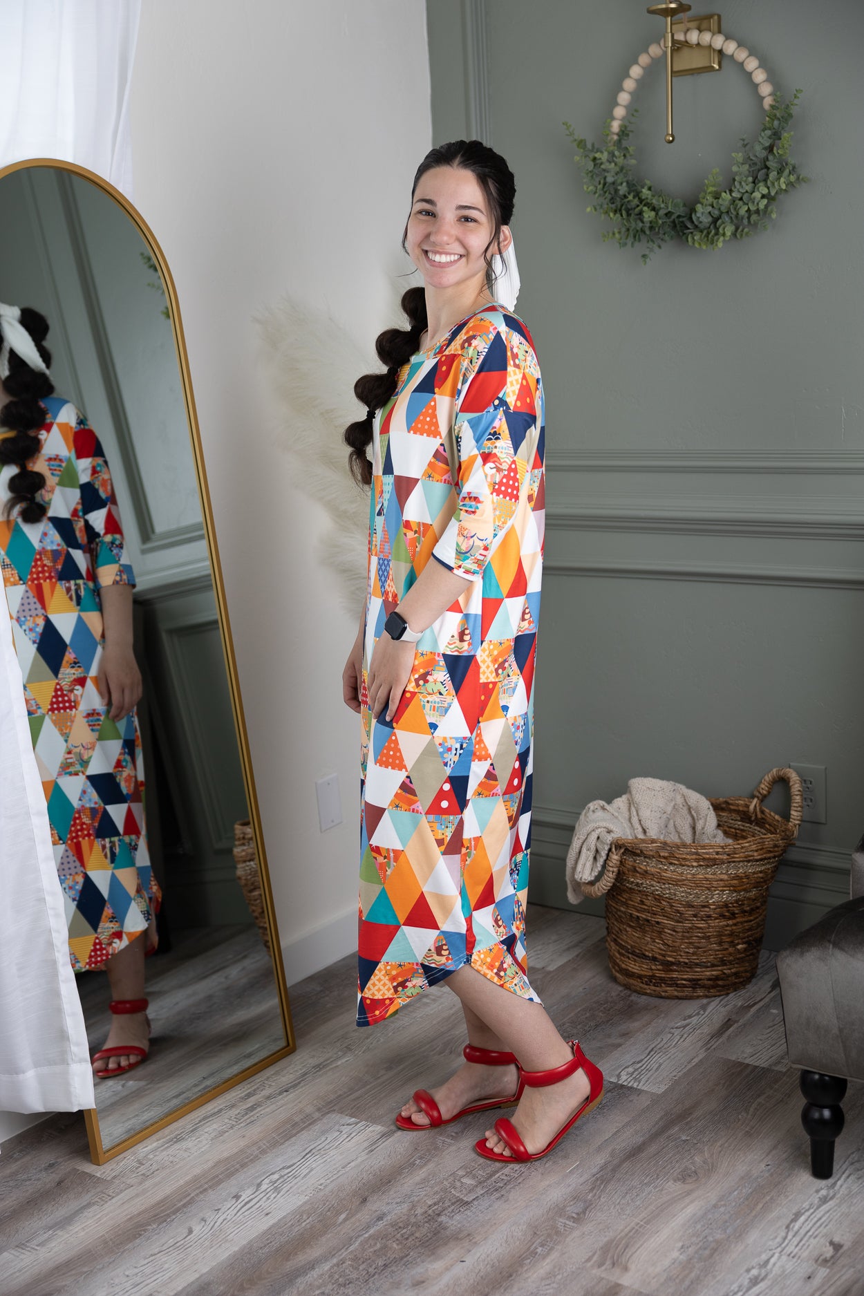 Model wearing Nuggles® Heather Dress in Triangle Taffy