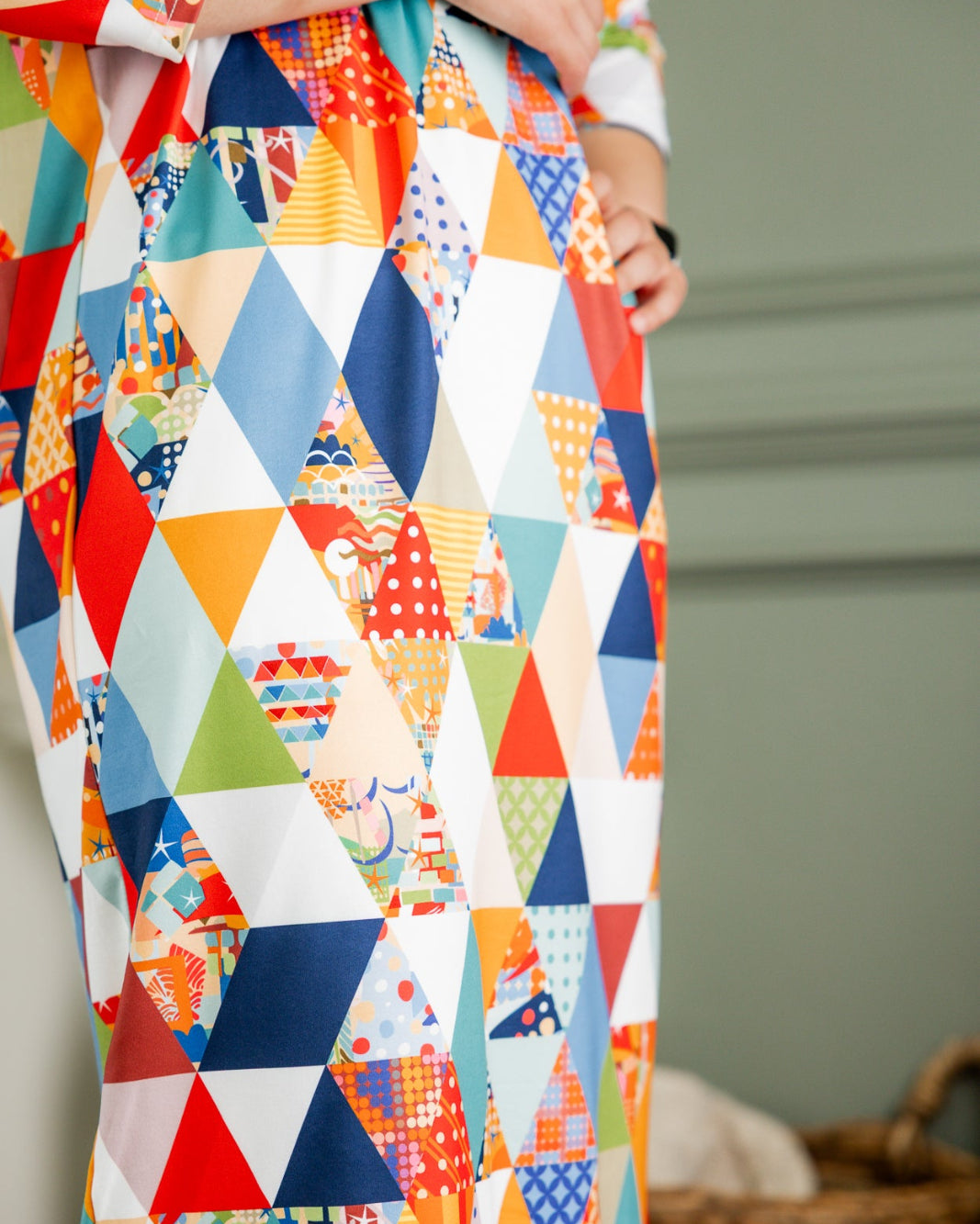 Model wearing Nuggles® Heather Dress in Triangle Taffy