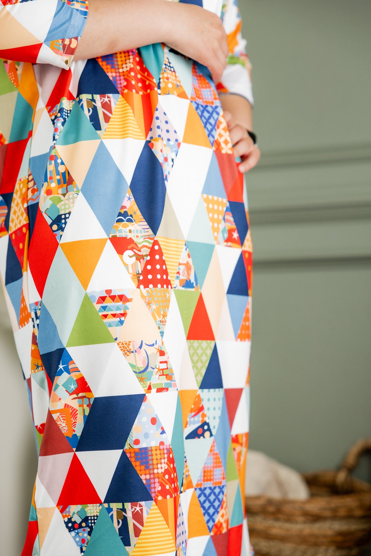 Model wearing Nuggles® Heather Dress in Triangle Taffy