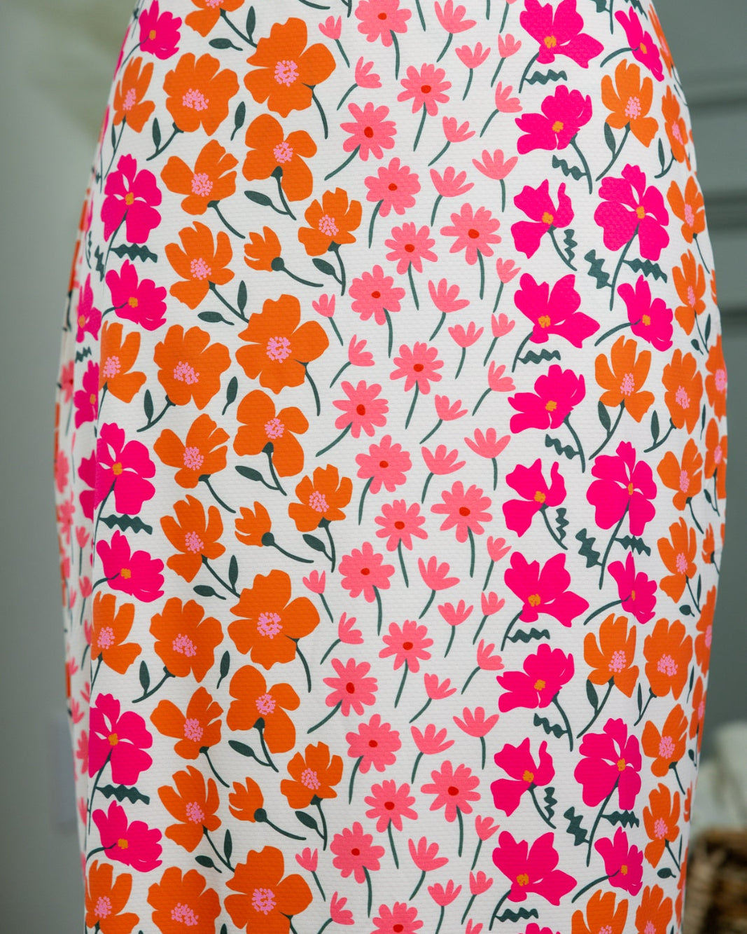 Model wearing Nuggles® 31" All-Sport Skirt in Meadow Sunset Garden