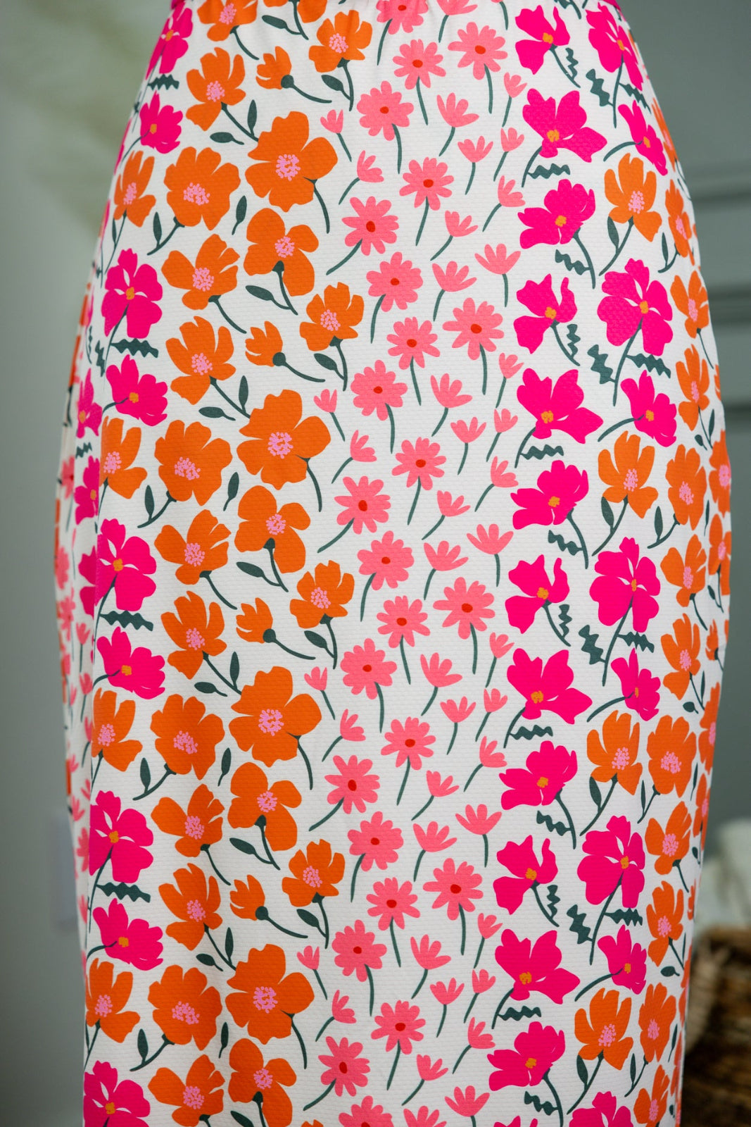 Model wearing Nuggles® 31" All-Sport Skirt in Meadow Sunset Garden