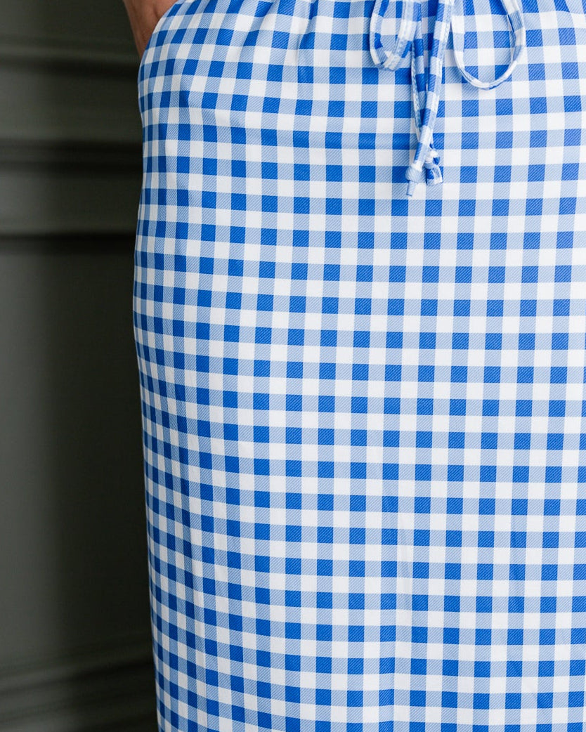 Model wearing Nuggles®3 1" Drawstring Skirt in Sky Gingham