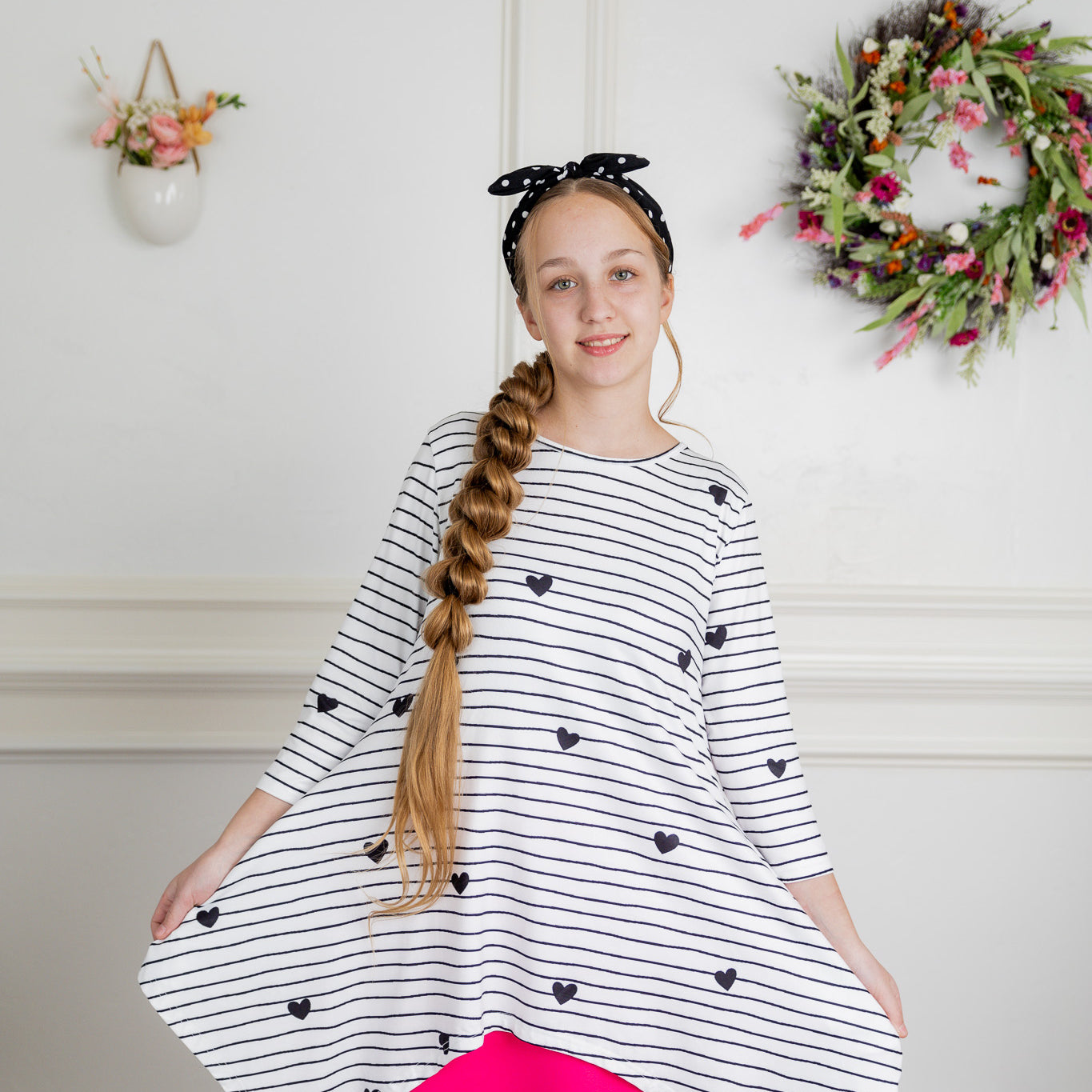 Woman wearing the Sheyanne Top by Nuggles® – modest 3/4-sleeve top with pockets, soft Tiff fabric, styled with a classic skirt for a comfortable and elegant look.