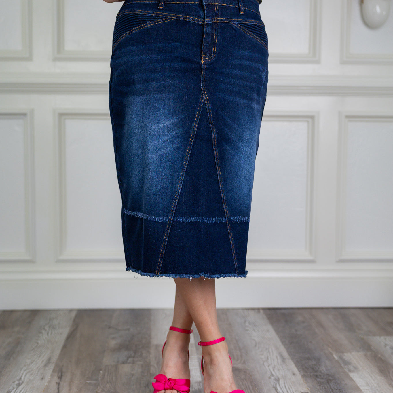 Nuggles denim midi skirt with soft stretch fabric, wide elastic waistband, modest length, and functional pockets. Available in 27", 31", and 34" lengths.