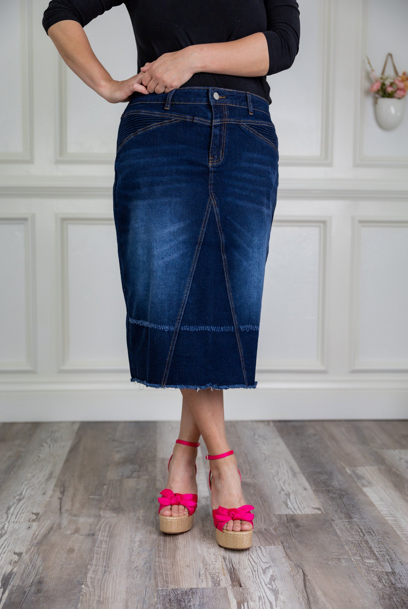 Nuggles® denim midi skirt with soft stretch fabric, wide elastic waistband, modest length, and functional pockets. Available in 27", 31", and 34" lengths.
