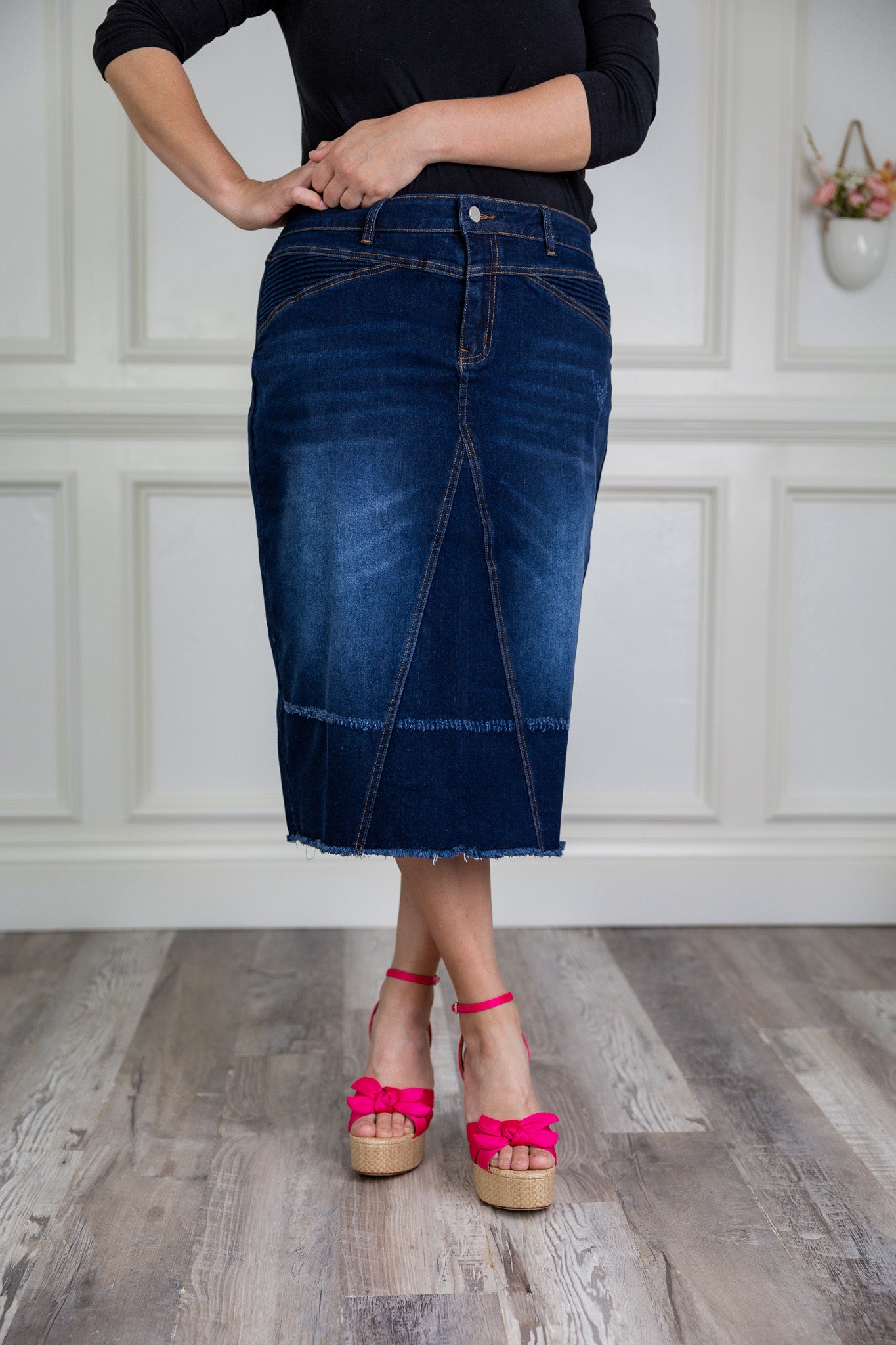 Nuggles® denim midi skirt with soft stretch fabric, wide elastic waistband, modest length, and functional pockets. Available in 27", 31", and 34" lengths.