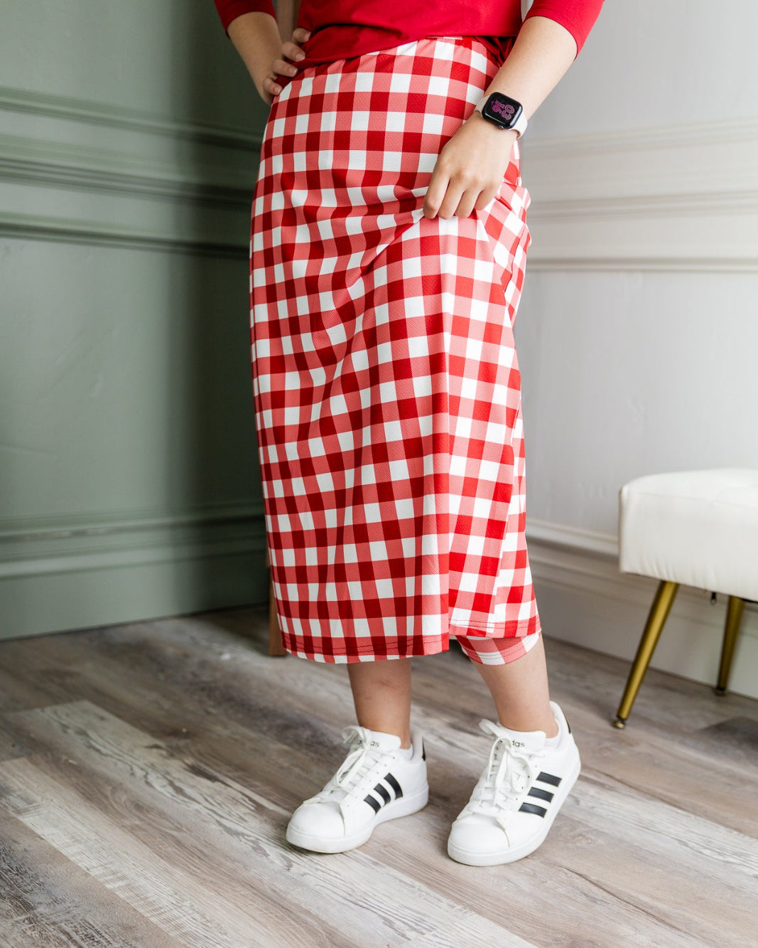 Model wearing Nuggles® 31" All-Sport Skirt in Cherry Jam
