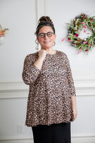 Model wearing the 3/4 Sleeve Victoria Top in floral print, paired with a modest Classic skirt. Modest women’s fashion with 3/4 sleeves and hip-length fit, perfect for church, work, or everyday wear.