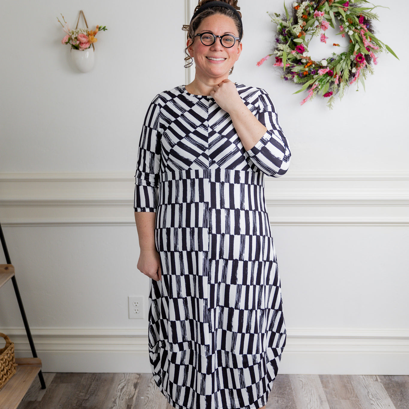 Model wearing the Cindy Bubble Dress with elbow-length sleeves, a modest neckline, and a gathered bubble hem in a midi-length silhouette.