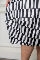 Model wearing the Cindy Bubble Dress with elbow-length sleeves, a modest neckline, and a gathered bubble hem in a midi-length silhouette.