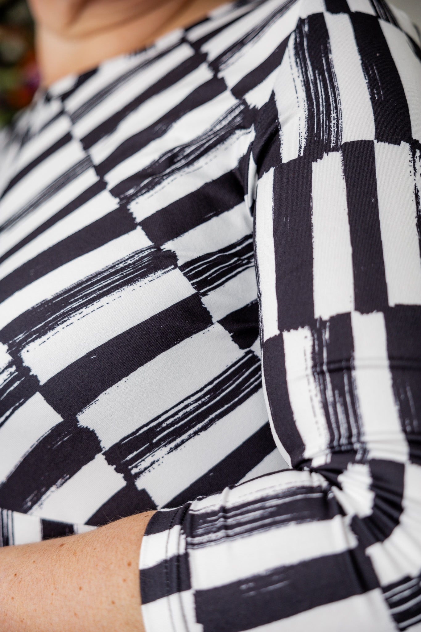 Model wearing the Cindy Bubble Dress with elbow-length sleeves, a modest neckline, and a gathered bubble hem in a midi-length silhouette.