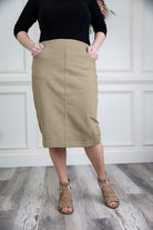 Nuggles denim midi skirt with soft stretch fabric, wide elastic waistband, modest length, and functional pockets. Available in 27", 31", and 34" lengths.