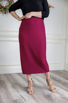 Textured midi-length skirt with elastic waistband and modest fit.