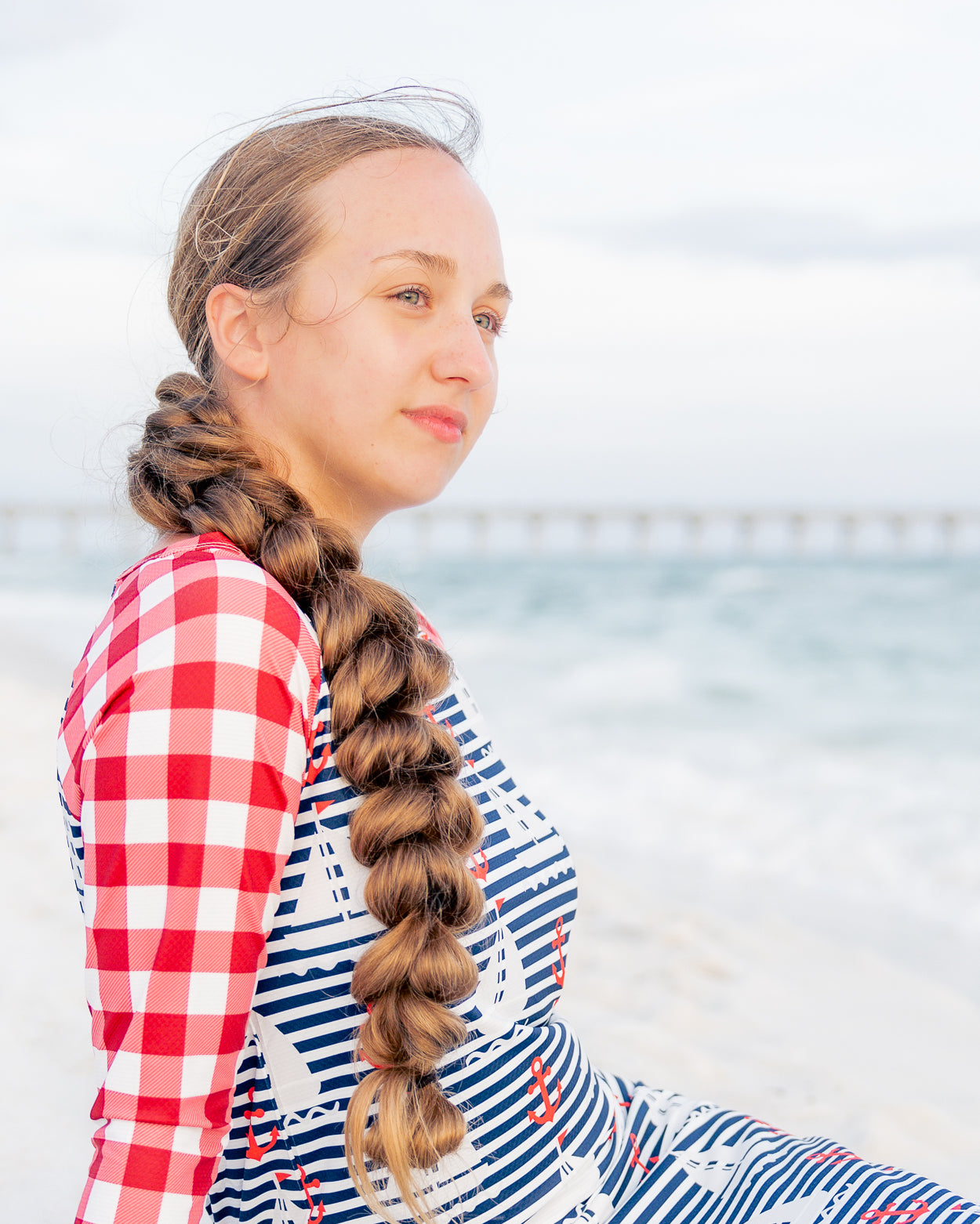 Model wearing Nuggles® Sport Swim Dress in Happy Campers
