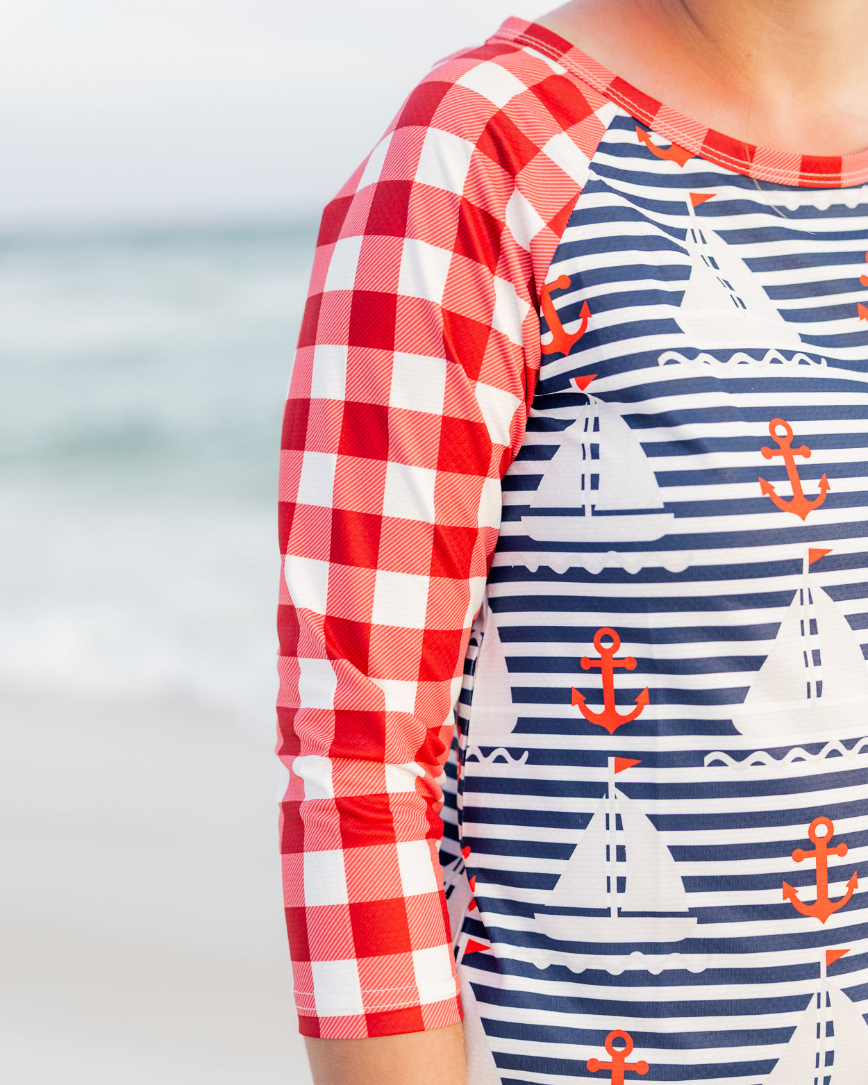 Model wearing Nuggles® Sport Swim Dress in Happy Campers