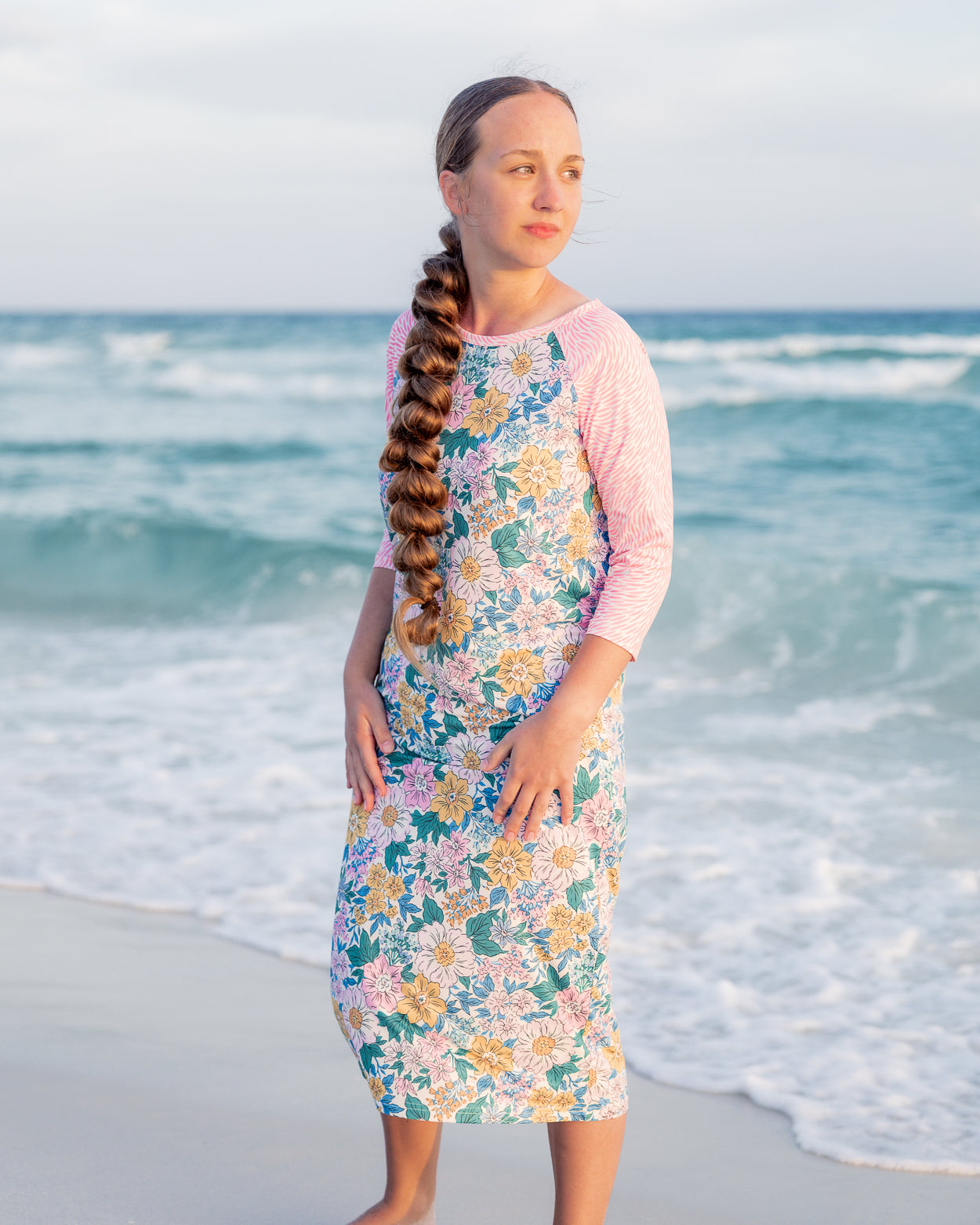 Model wearing Nuggles® Sport Swim Dress in Daisy Daydream