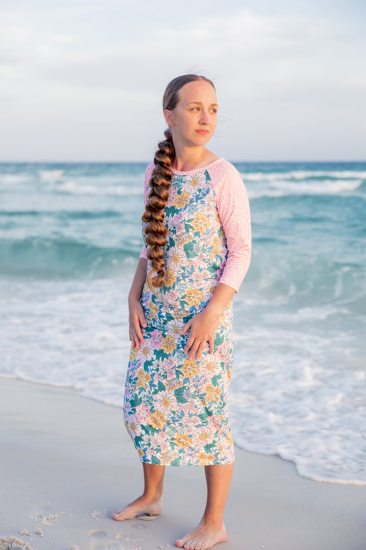 Model wearing Nuggles® Sport Swim Dress in Daisy Daydream