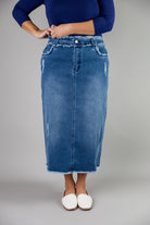 Nuggles® denim midi skirt with soft stretch fabric, wide elastic waistband, modest length, and functional pockets. Available in 27", 31", and 34" lengths.