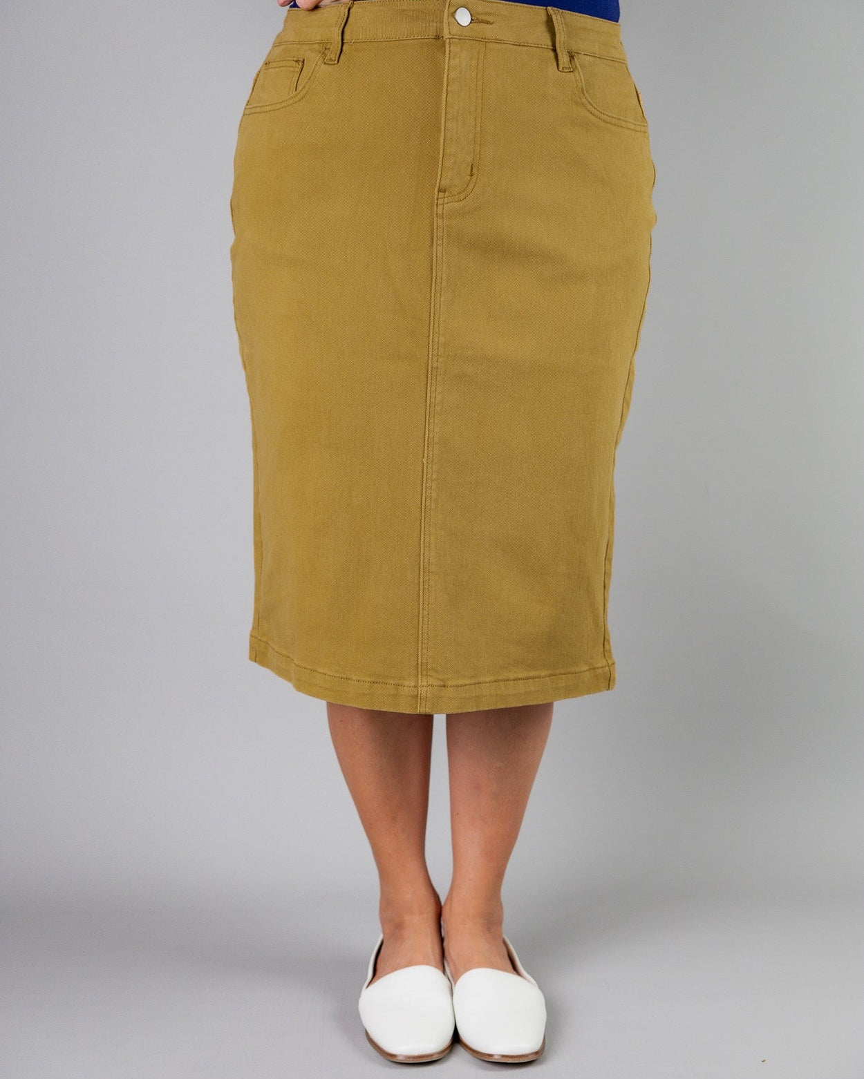 Nuggles® denim midi skirt with soft stretch fabric, wide elastic waistband, modest length, and functional pockets. Available in 27", 31", and 34" lengths.