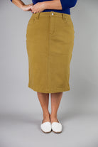 Nuggles® denim midi skirt with soft stretch fabric, wide elastic waistband, modest length, and functional pockets. Available in 27", 31", and 34" lengths.